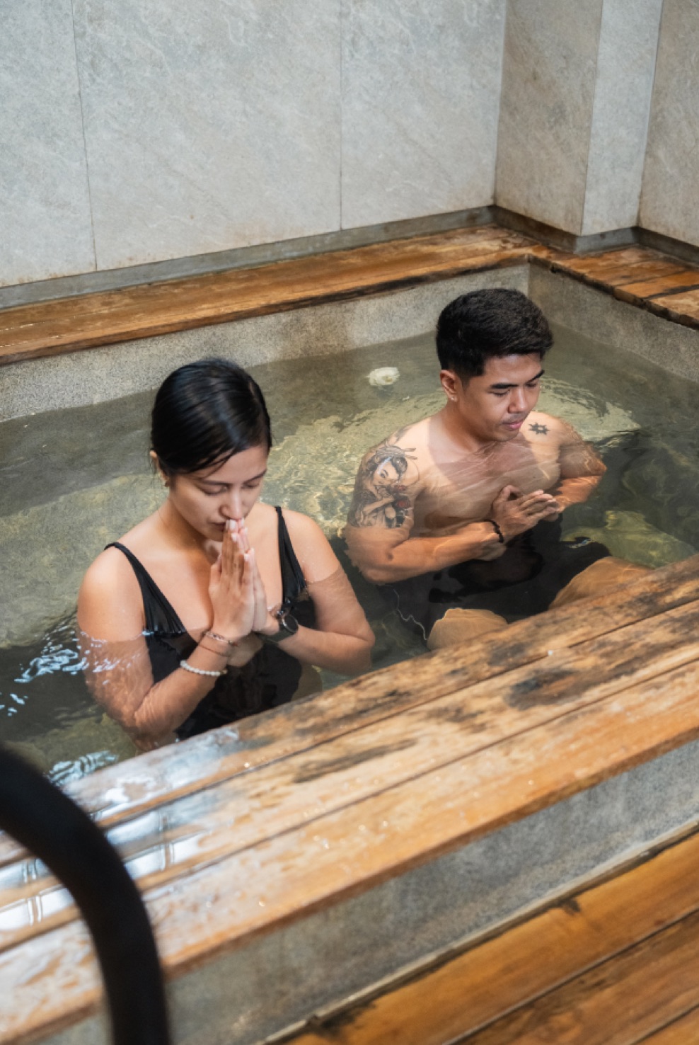 Two members in the ice bath in the Saya Club recovery area
