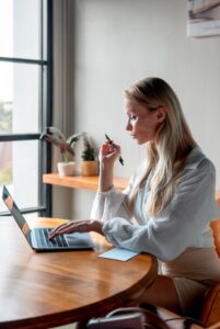 A member working on a laptop at Saya Work coworking